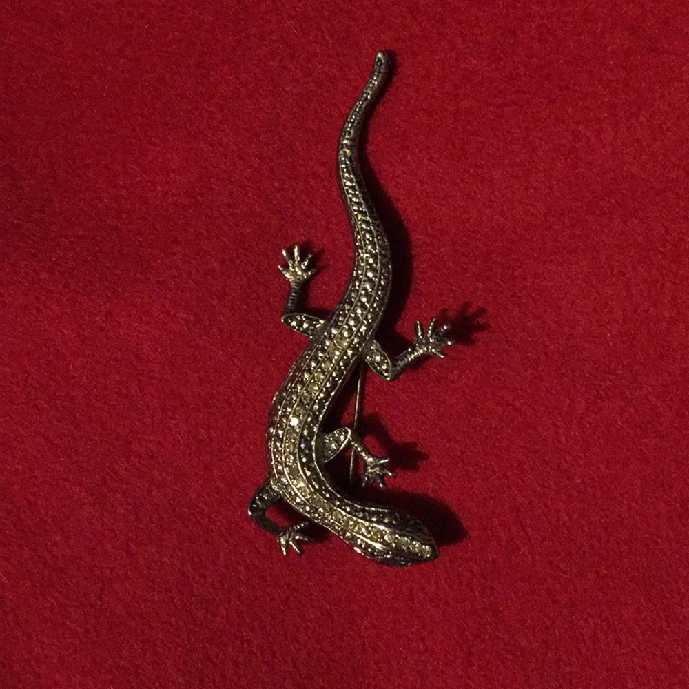 Sleek lizard with green eyes